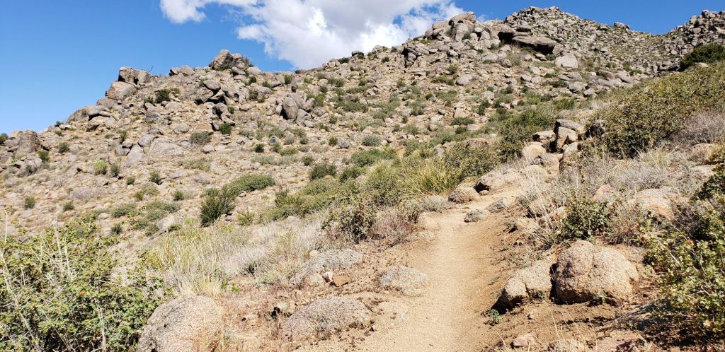 Dry trail leads through granite boulders on the Hotshots Trail