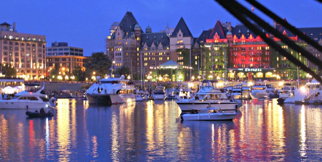 Victoria’s inner harbor at night fall reflects lights from the city