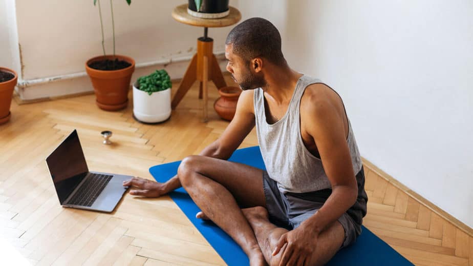 A young man doing workout at home