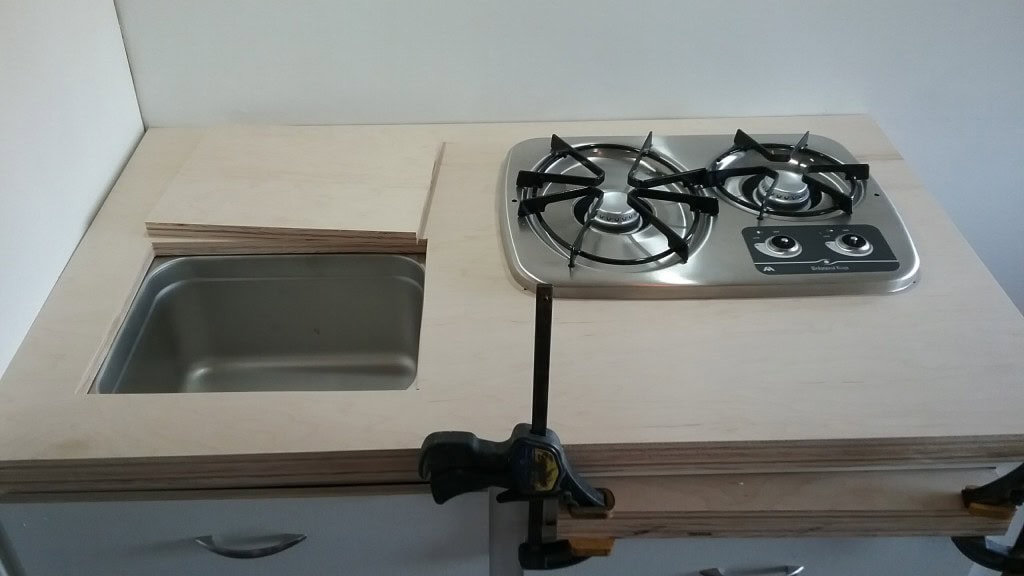 undermount sink with a custom cutting board top.