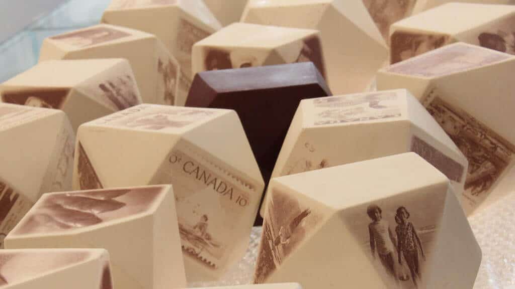 Postmarked (Installation View), each tetrahedron 14cm x 14m x 14cm , porcelain, iron-oxide ceramic decal, 2017, photo credit: Josie Slaughter