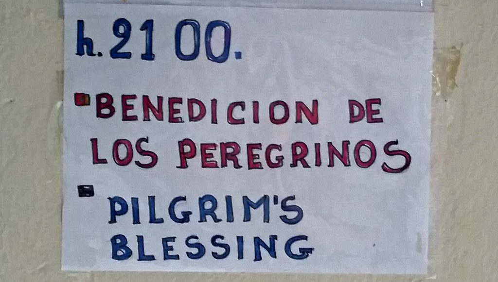 Handmade sign reading "Pilgrims Blessing" in Spanish and English on Camino de Santiago