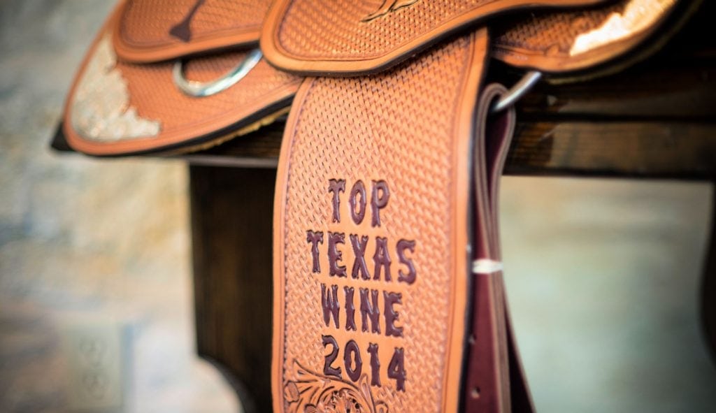 close up of saddle and stirup imprinted with "Top Texas Wine 2014"