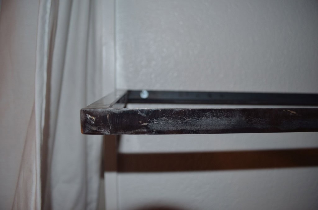 Here is a detail show of how the lag bolts go (out of focus). The smaller shelf just has three lag bolts which are into wood backing.