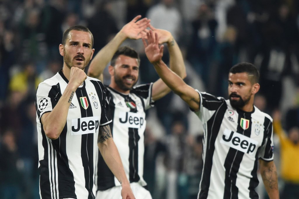 Juventus' defender from Italy Leonardo Bonucci (L), Juventus' defender from Italy Andrea Barzagli and Juventus midfielder from Venezuela Tomas Rincon celebrate after winning the UEFA Champions League quarter final first leg football match Juventus vs Barcelona, on April 11, 2017 at the Juventus stadium in Turin. Juventus won 3-0. / AFP PHOTO / Miguel MEDINA (Photo credit should read MIGUEL MEDINA/AFP/Getty Images)