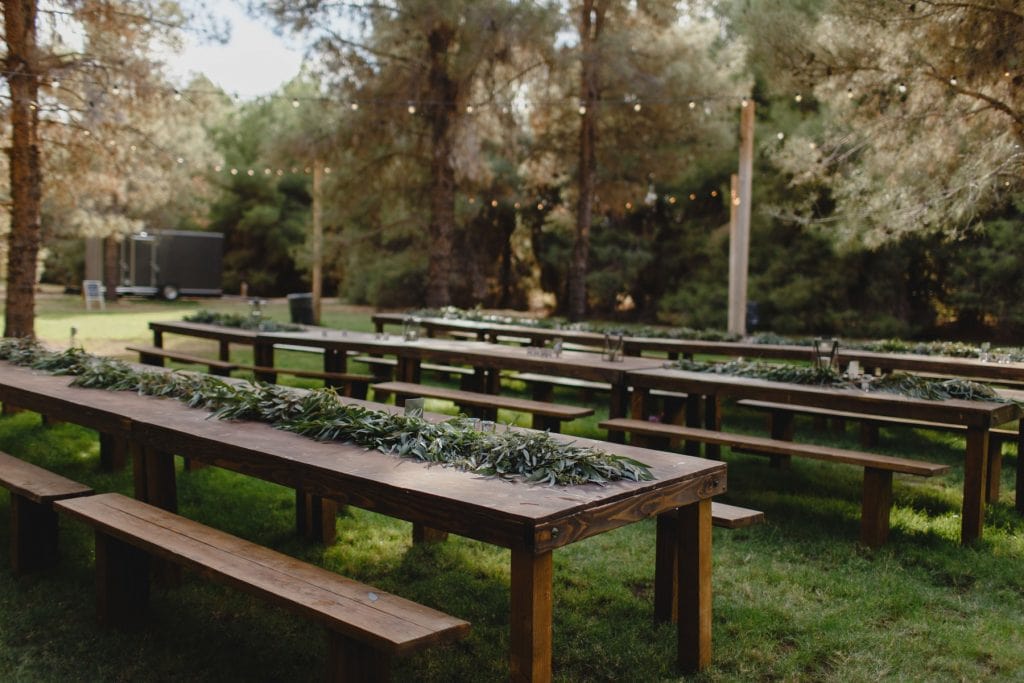 forest wedding in Phoenix with rustic wood reception tables