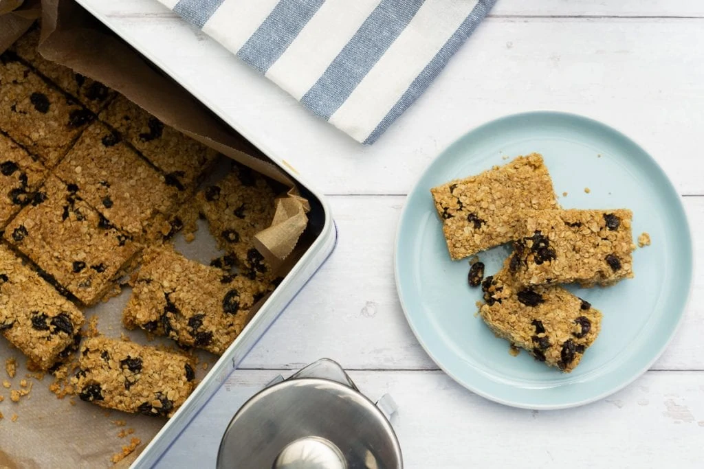 Flapjacks on a plate and in a biscuit tin