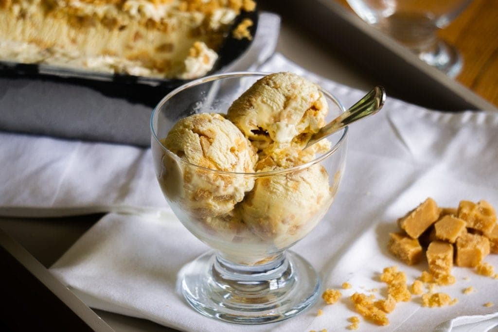 Tablet Ice Cream Recipe in a bowl on a tray with Tablet Ice-Cream tub and Scottish tablet chunks