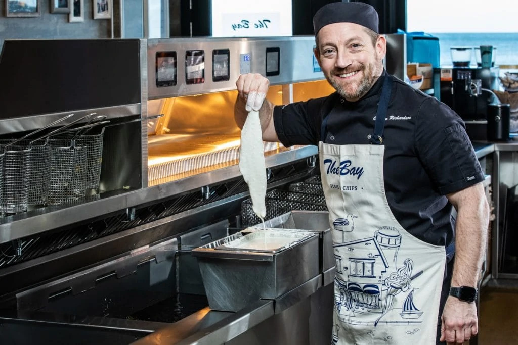 The Bay Fish and Chips Scotland - Calum putting fish in the fryer
