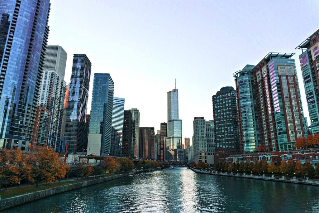 Chicago skyline dwarfs Chicago River. Photo taken near water level - urban kayaking Chicago
