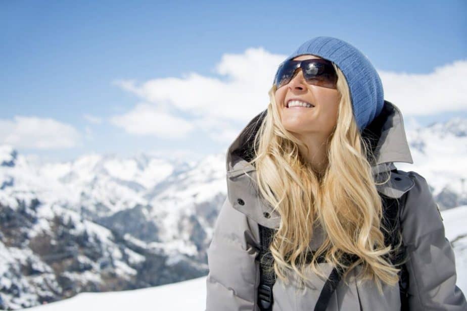 A girl is wearing sunglasses for protection