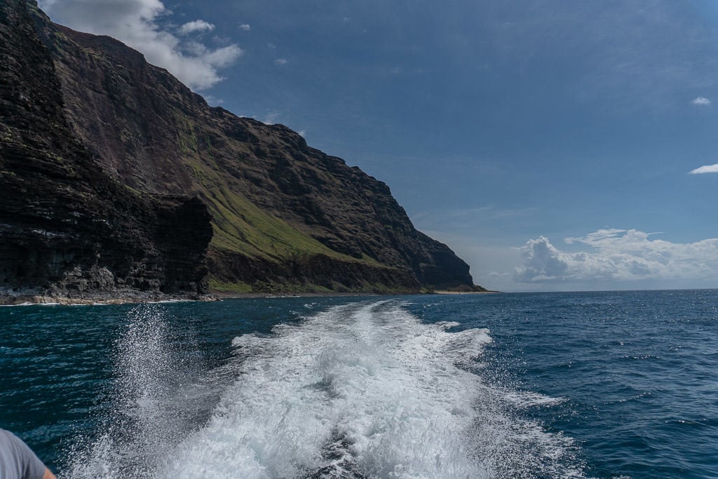 speeding away on napali coast boat tour in Kauai