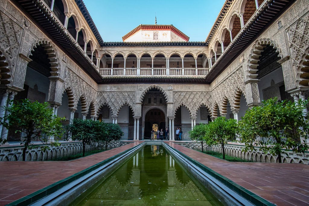 unique architecture and small pond in the real alcazar in sevilla spain