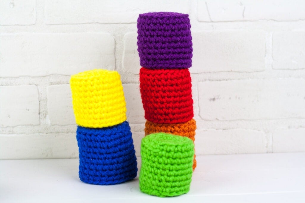 A quick crochet toy can keep the kids busy for hours. Use the free crochet pattern to make a minimalist bowling game for the kids.