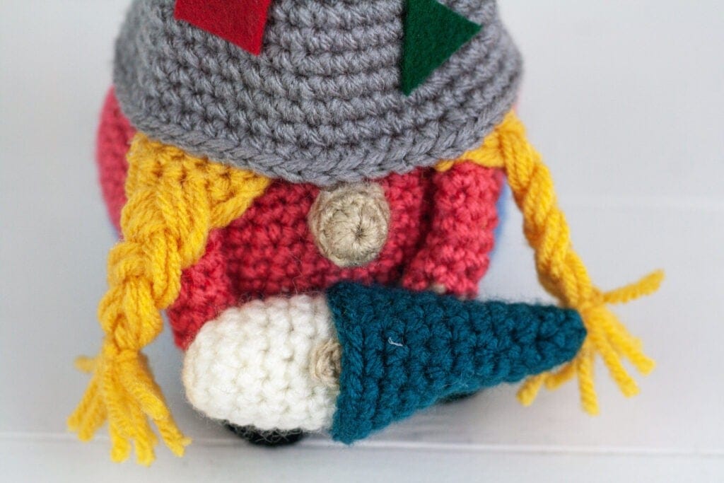 Crochet a daycare gnome or mommy and a baby gnome with this free crochet pattern. This gnome makes a great gift or just add them to your collection.