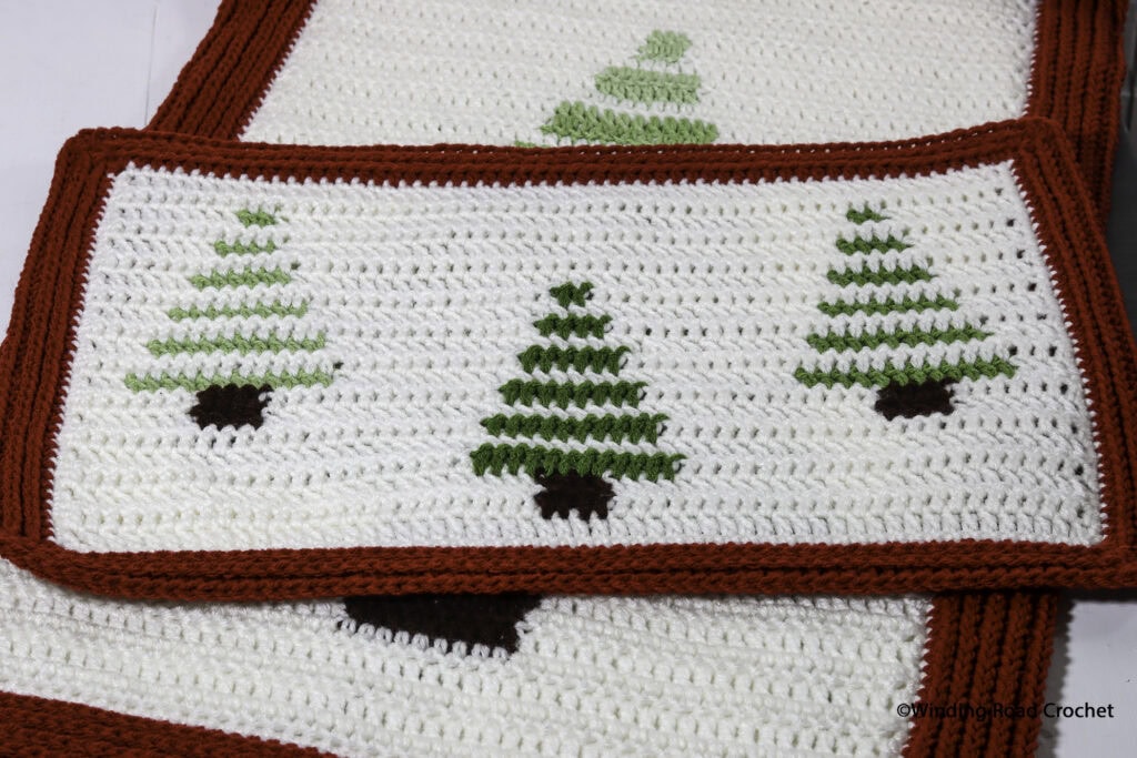 Make a modern ombre crochet table runner and matching placemats. Free crochet pattern with helpful video tutorials. Perfect for all winter.