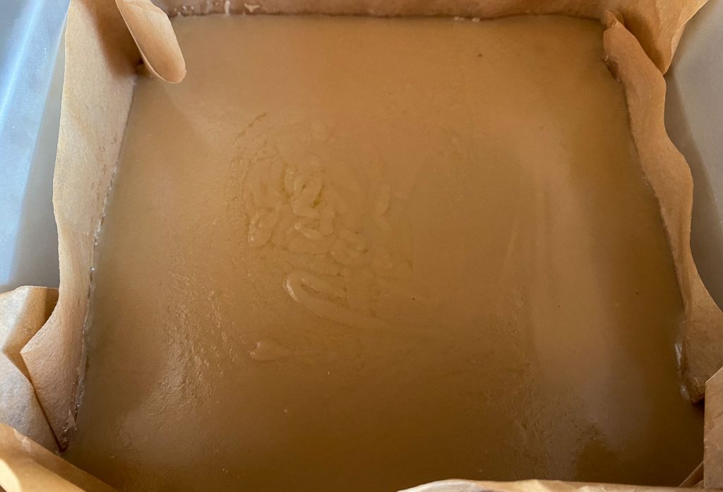 Millionaire Bars Recipe - Caramel Layer cooling in the tin