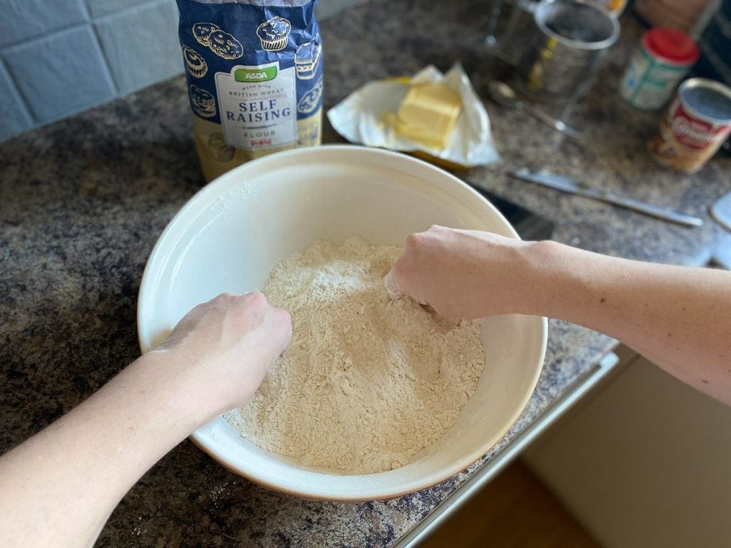 Rubbing flour and butter together for easy Scottish scone recipe