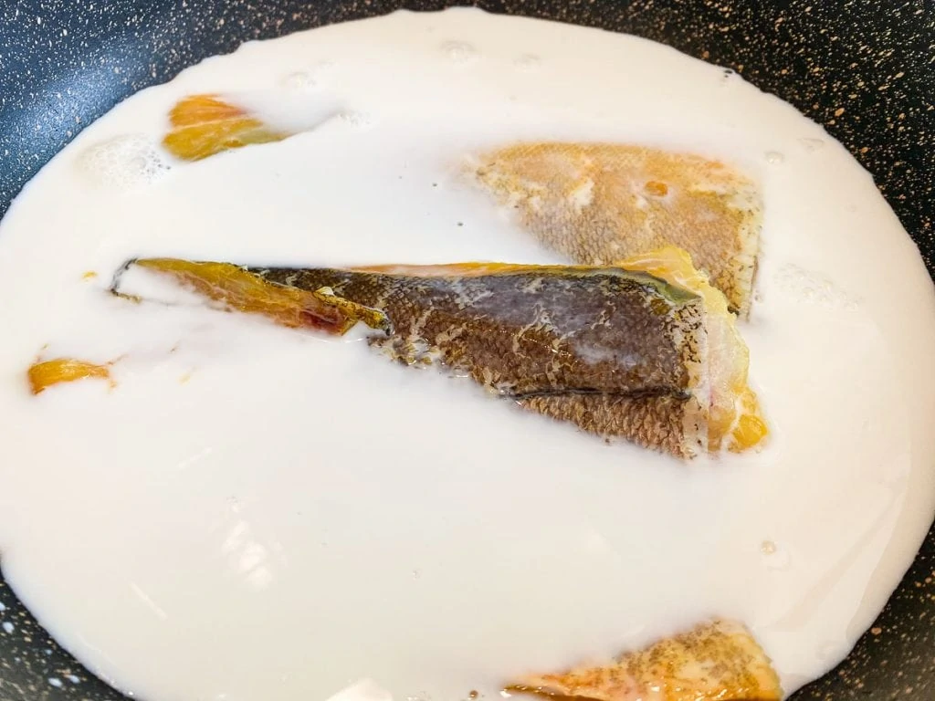 Cooking smoked haddock in milk for Cullen Skink Recipe