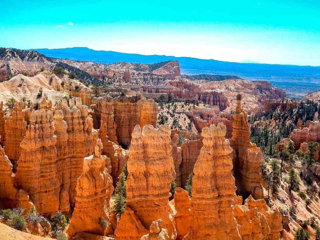 Looking down on the orange hoodoos at bryce canyon national park with the blue sky overhead