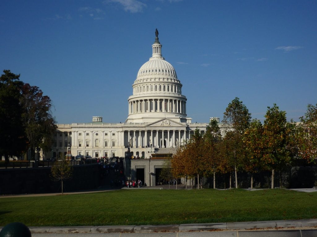 US Capitol building with white dome set against clear blue sky