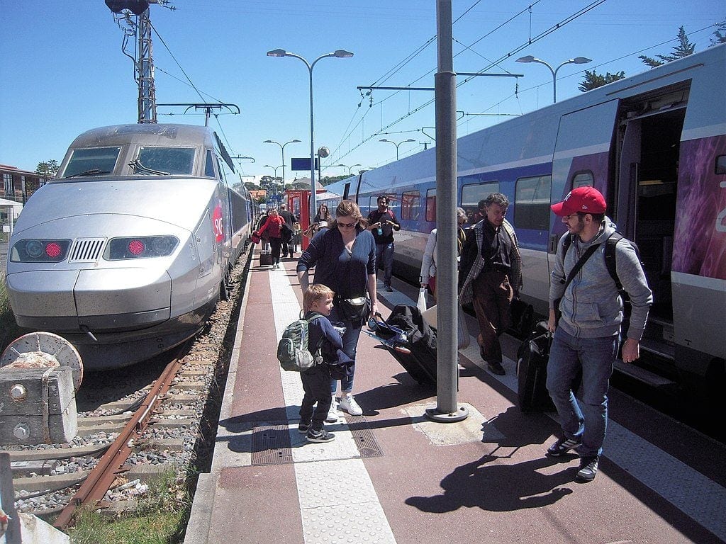Passengers debarking in front of fast TGV train from Bordeaux at D'archon station