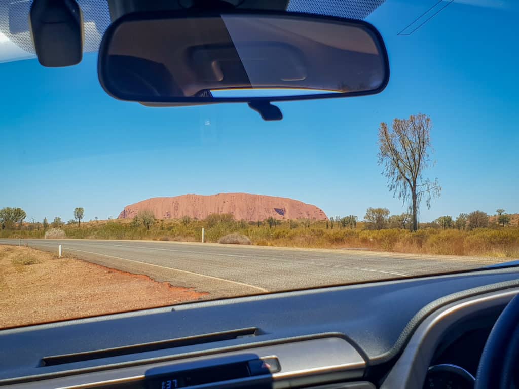 Uluru through car windscreen