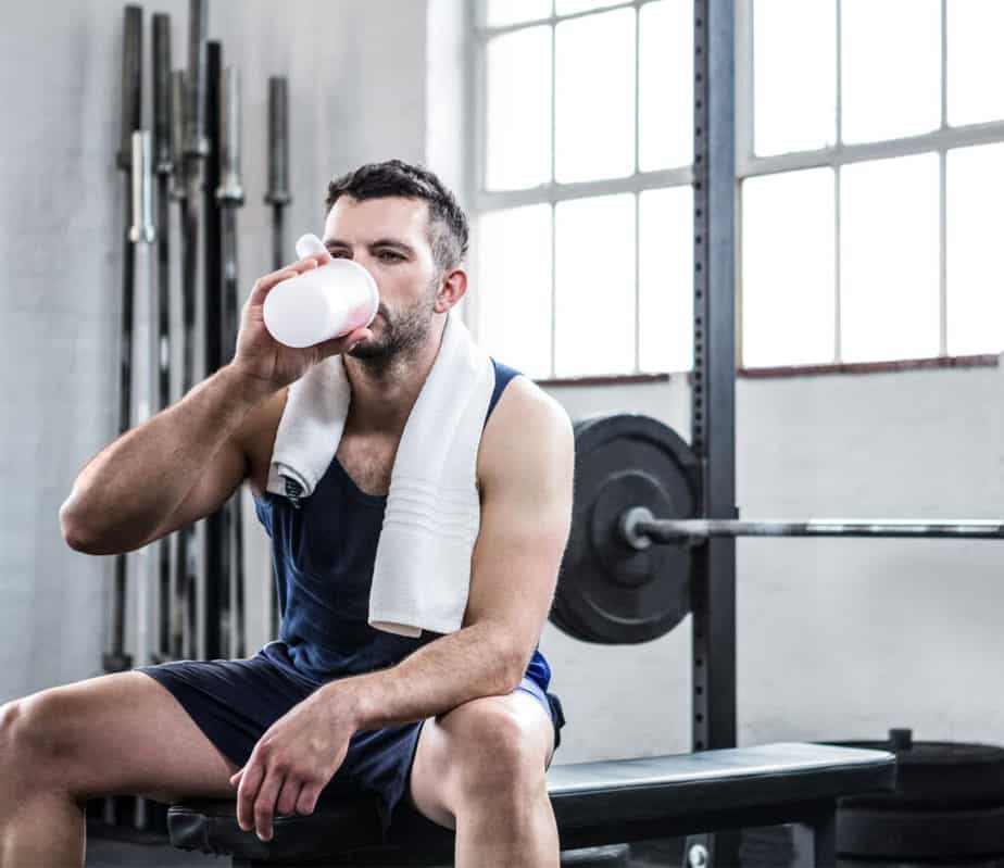 A guy is having rest at the gym