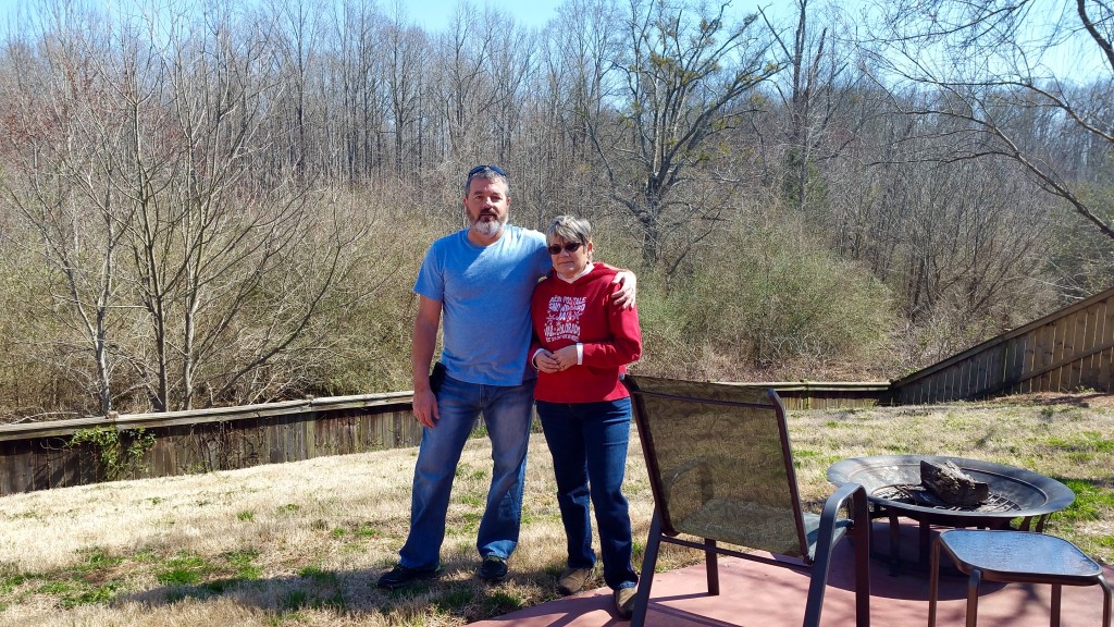 Greg and I in our beautiful backyard overlooking the nature preserve. I don't look too happy in this picture, do I? THIS is what I will miss the most about our old house. That said, now our backyard will change regularly and I can't wait.