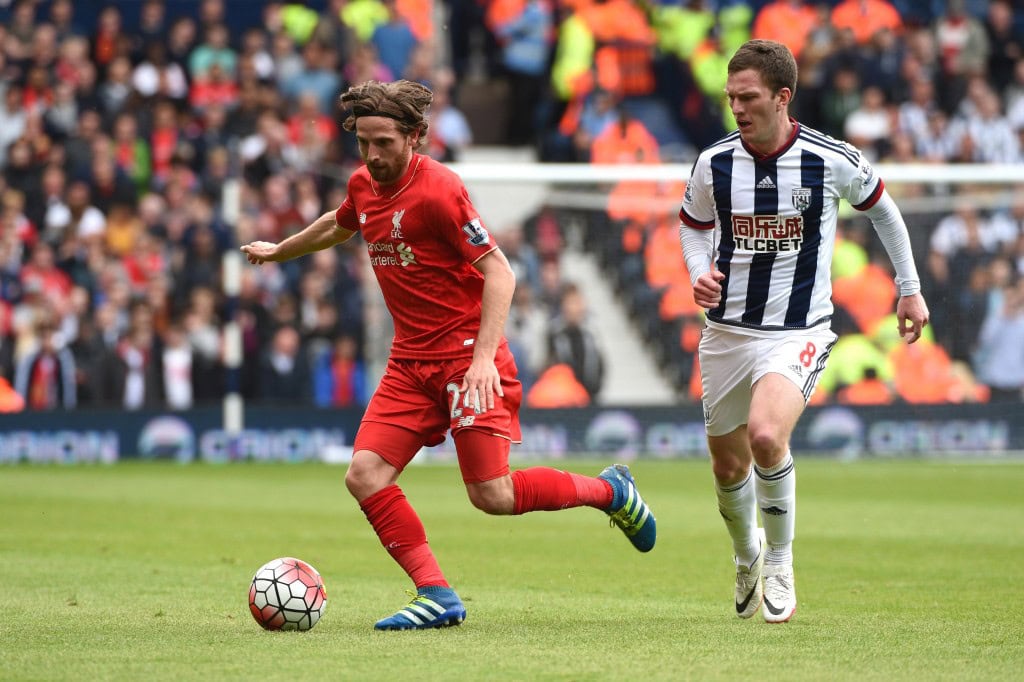 WEST BROMWICH, ENGLAND - MAY 15: Joe Allen of Liverpool and Craig Gardner of West Bromwich Albion compete for the ball during the Barclays Premier League match between West Bromwich Albion and Liverpool at The Hawthorns on May 15, 2016 in West Bromwich, England.
