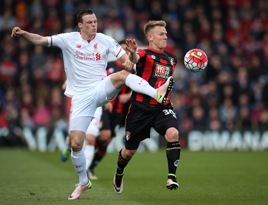 BOURNEMOUTH, ENGLAND - APRIL 17: Brad Smith of Liverpool and Matt Ritchie of Bournemouth battle for posession during the Barclays Premier League match between A.F.C. Bournemouth and Liverpool at the Vitality Stadium on April 17, 2016 in Bournemouth, England. (Photo by Steve Bardens/Getty Images)