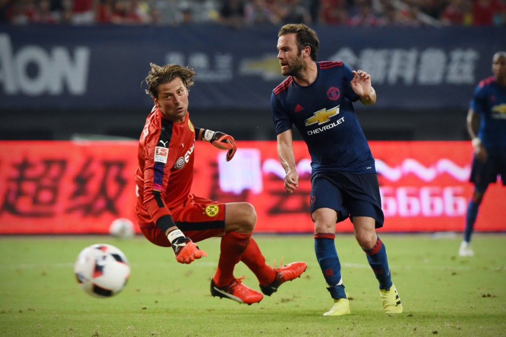 Juan Mata seems to have started on the path of his redemption with Jose Mourinho after a couple of assists in two pre-season games for the Spaniard. (Picture Courtesy - AFP/Getty Images)