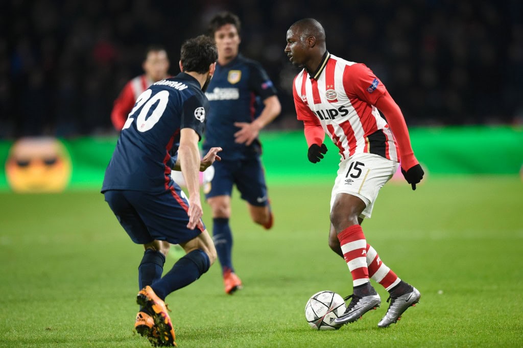 PSV Eindhoven's defender Jetro Willems (R) challenges Atletico Madrid's defender Juanfran during the UEFA Champions League round of 16 first leg football match between PSV Eindhoven and Atletico Madrid at the Philips Stadium in Eindhoven on February 24, 2016. AFP PHOTO / JOHN THYS / AFP / JOHN THYS (Photo credit should read JOHN THYS/AFP/Getty Images)