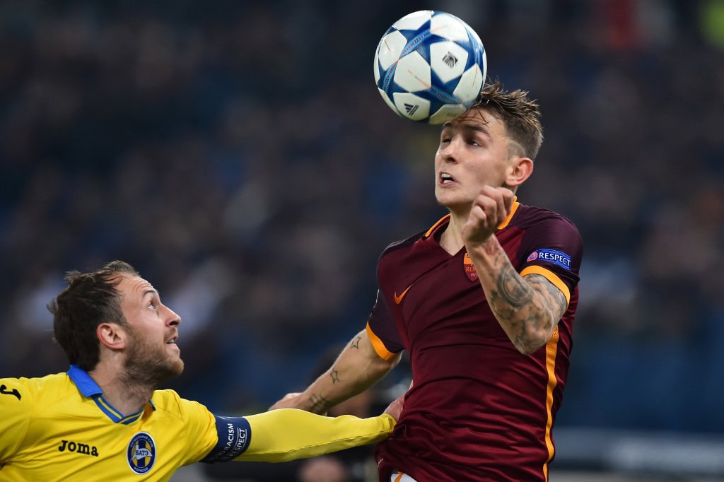 Bate Borisov's midfielder Igor Stasevich (L) vies with Roma's defender from France Lucas Digne during the UEFA Champions League football match AS Roma vs Bate Borisov on December 9, 2015 at the Olympic Stadium in Rome. AFP PHOTO / GABRIEL BOUYS / AFP / GABRIEL BOUYS (Photo credit should read GABRIEL BOUYS/AFP/Getty Images)