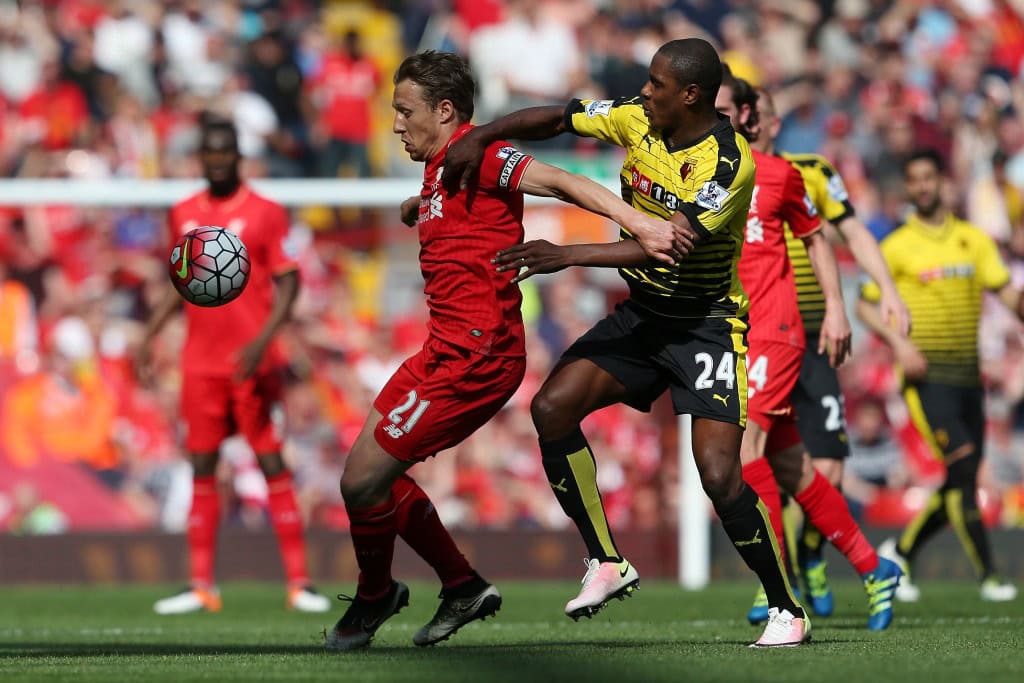 LIVERPOOL, ENGLAND - MAY 08: Lucas Leiva of Liverpool holds off Odion Ighalo of Watford during the Barclays Premier League match between Liverpool and Watford at Anfield on May 8, 2016 in Liverpool, England. (Photo by Jan Kruger/Getty Images)