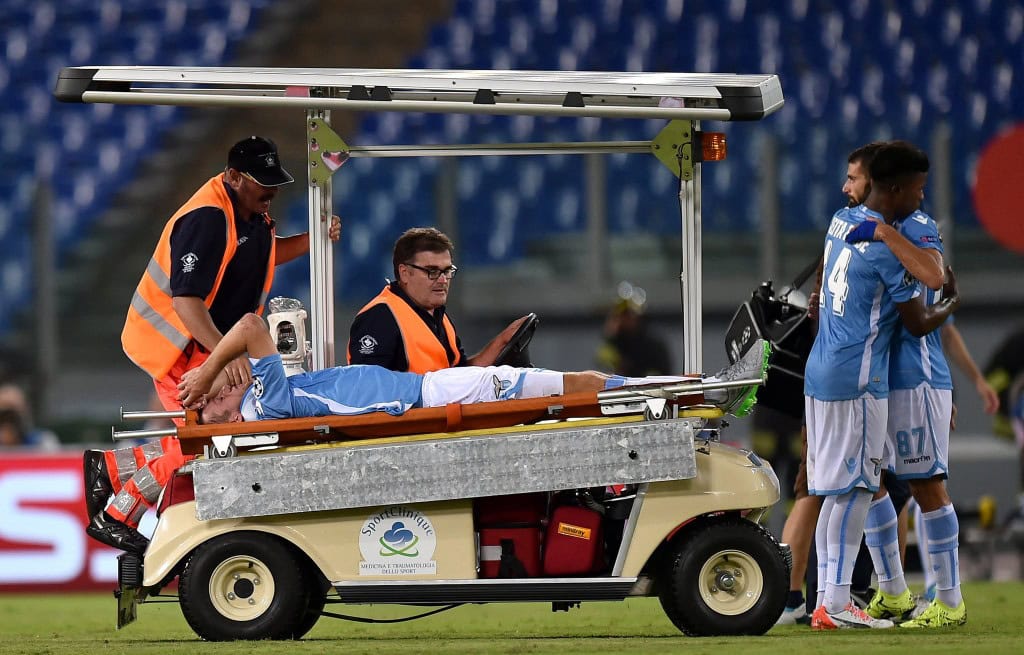 Lazio's defender from Netherlands Stefan de Vrij is carried out of the pitch after getting injured during the UEFA Champions League playoff football match between Lazio and Bayer Leverkusen, at Olympic stadium in Rome on August 18, 2015. AFP PHOTO / ALBERTO PIZZOLI (Photo credit should read ALBERTO PIZZOLI/AFP/Getty Images)