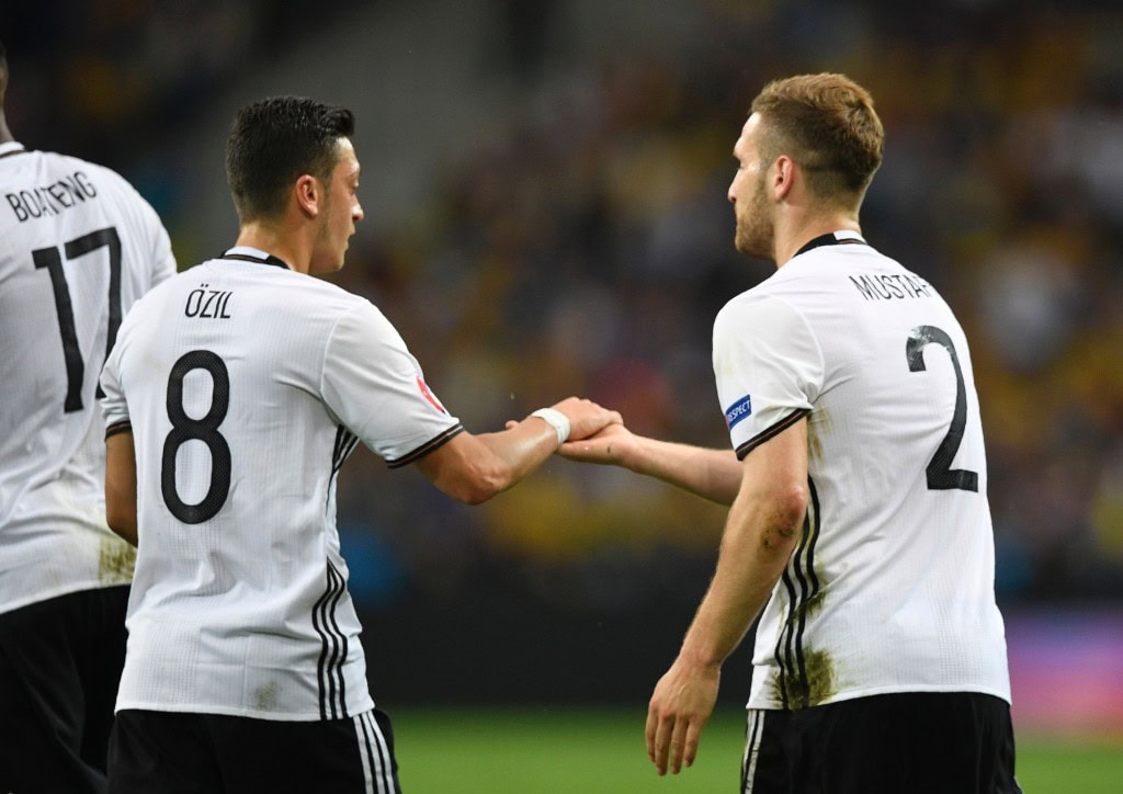 Germany's defender Shkodran Mustafi (R) celebrates with Germany's midfielder Mesut Oezil after scoring a goal during the Euro 2016 group C football match between Germany and Ukraine at the Stade Pierre Mauroy in Villeneuve-d'Ascq near Lille on June 12, 2016. / AFP / MARTIN BUREAU (Photo credit should read MARTIN BUREAU/AFP/Getty Images)
