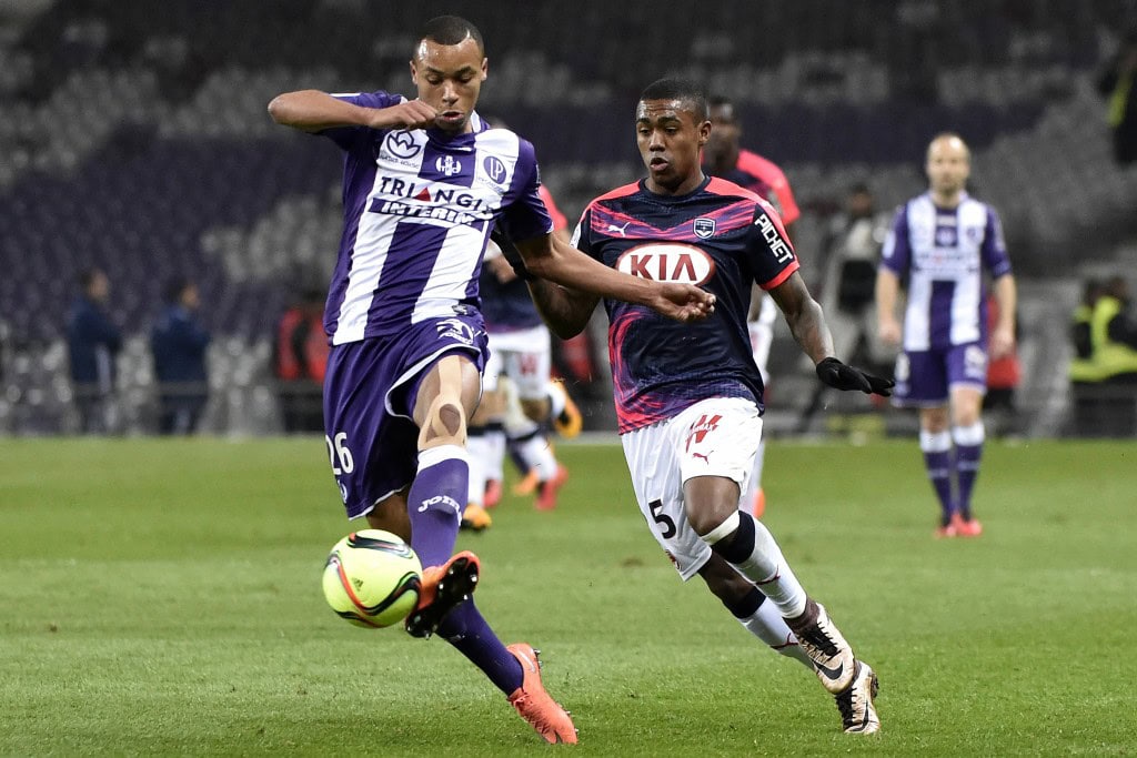 Toulouse's Congolese defender Marcel Tisserand (L) vies with Bordeaux's French forward Malcom during the French L1 football match between Toulouse and Bordeaux at the Municipal Stadium in Toulouse on March 12, 2016. AFP PHOTO / PASCAL PAVANI / AFP / PASCAL PAVANI (Photo credit should read PASCAL PAVANI/AFP/Getty Images)