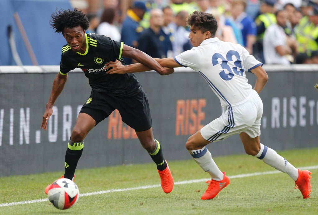 Chelsea forward Juan Cuadrado (L) kicks the ball past Real Madrid defender Achraf Hakimi (R) during an International Champions Cup soccer match in Ann Arbor, Michigan on July 30, 2016. / AFP / Jay LaPrete (Photo credit should read JAY LAPRETE/AFP/Getty Images)