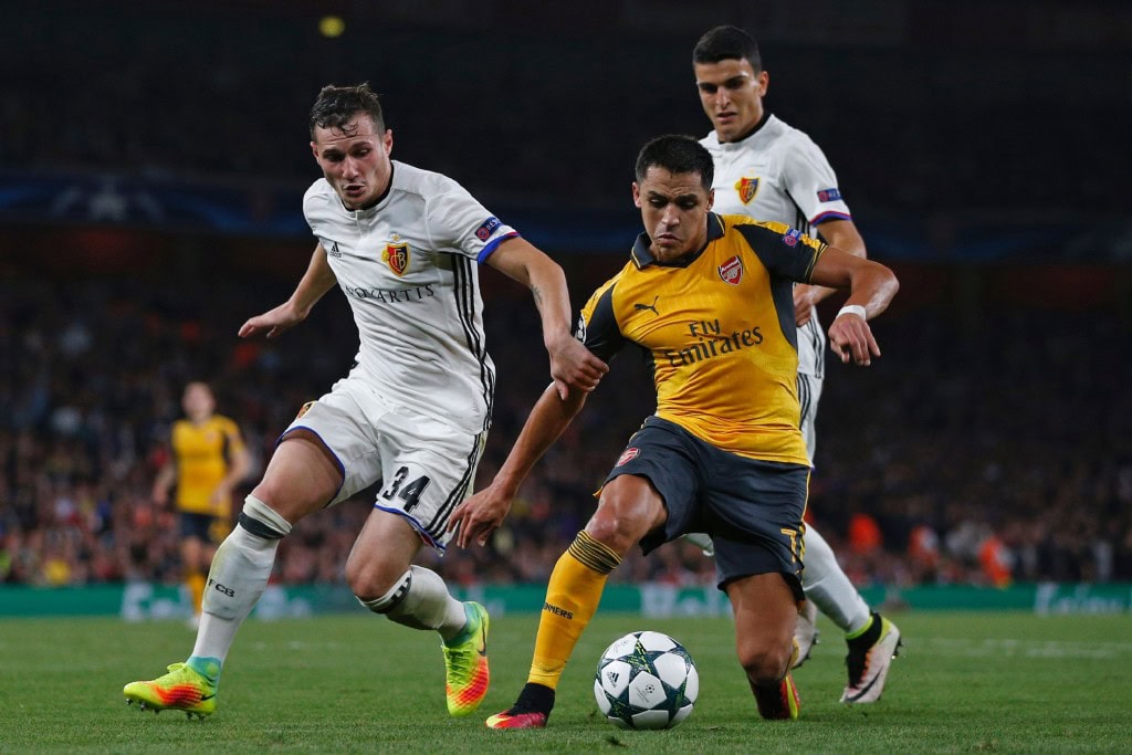 Arsenal's Chilean striker Alexis Sanchez (R) vies with Basel's Albanian midfielder Taulant Xhaka (L) during the UEFA Champions League Group A football match between Arsenal and FC Basel at The Emirates Stadium in London on September 28, 2016. Arsenal won the game 2-0. (Photo by Adrian Dennis/AFP/Getty Images)