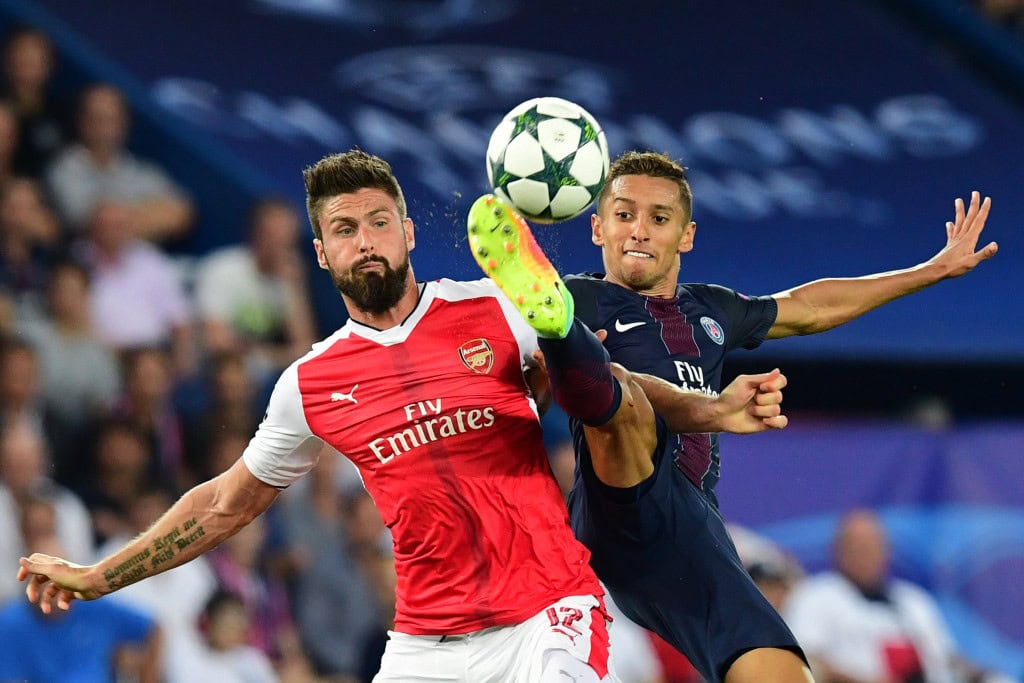 Arsenal's French forward Olivier Giroud (L) vies with Paris Saint-Germain's Brazilian defender Marquinhos during the UEFA Champions League Group A football match between Paris-Saint-Germain vs Arsenal FC, on September 13, 2016 at the Parc des Princes stadium in Paris. (Photo by Franck Fife/AFP/Getty Images)
