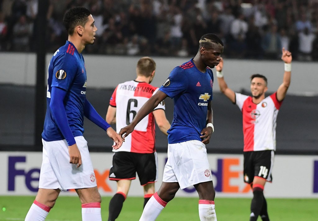 Manchester United's Paul Pogba (C) and Chris Smalling react after losing the UEFA Europa League football match between Feyenoord Rotterdam and Manchester United at the Feyenoord Stadium in Rotterdam on September 15, 2016. Feyenoord won the match 1-0. (Photo by Emmanuel Dunand/AFP/Getty Images)