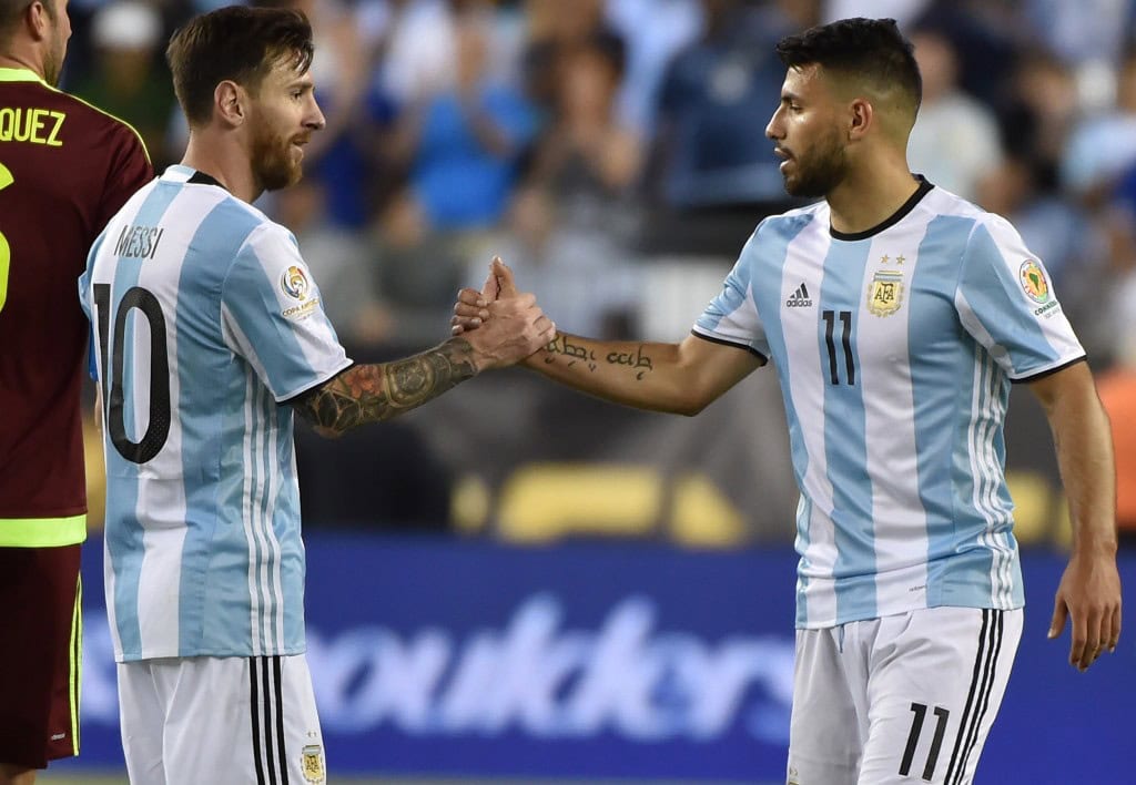 Argentina's Lionel Messi (L) greets Argentina's Sergio Aguero after their Copa America Centenario football quarterfinal match against Venezuela in Foxborough, Massachusetts, United States, on June 18, 2016. / AFP / Nelson ALMEIDA (Photo credit should read NELSON ALMEIDA/AFP/Getty Images)