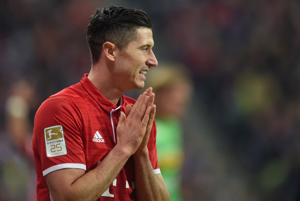 Bayern Munich's Polish forward Robert Lewandowski reacts during the German first division Bundesliga football match between FC Bayern Munich and Borussia Moenchengladbach in Munich, southern Germany, on October 22, 2016. / AFP / CHRISTOF STACHE / RESTRICTIONS: DURING MATCH TIME: DFL RULES TO LIMIT THE ONLINE USAGE TO 15 PICTURES PER MATCH AND FORBID IMAGE SEQUENCES TO SIMULATE VIDEO. == RESTRICTED TO EDITORIAL USE == FOR FURTHER QUERIES PLEASE CONTACT DFL DIRECTLY AT + 49 69 650050 (Photo credit should read CHRISTOF STACHE/AFP/Getty Images)