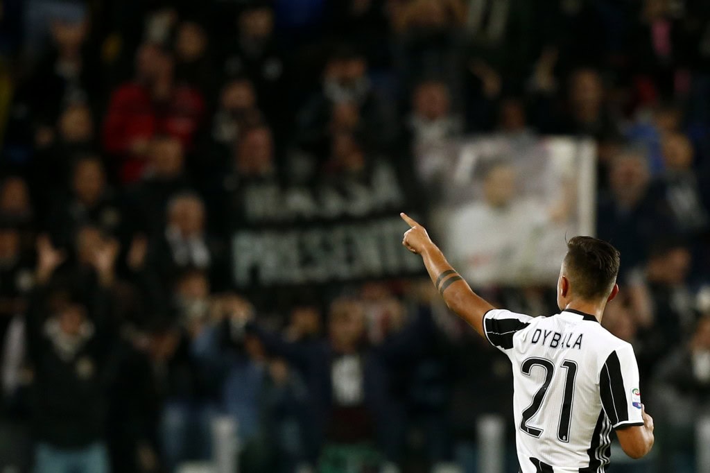 Juventus' forward Paulo Dybala from Argentina celebrates after scoring during the Italian Serie A football match Juventus vs Udinese on October 15, 2016 at the 'Juventus Stadium' in Turin. / AFP / MARCO BERTORELLO (Photo credit should read MARCO BERTORELLO/AFP/Getty Images)