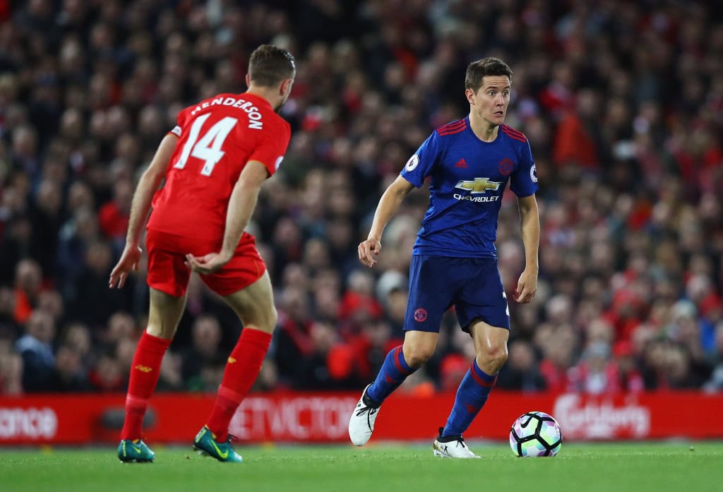 LIVERPOOL, ENGLAND - OCTOBER 17: Ander Herrera of Manchester United is closed down by Jordan Henderson of Liverpool during the Premier League match between Liverpool and Manchester United at Anfield on October 17, 2016 in Liverpool, England. (Photo by Clive Brunskill/Getty Images)
