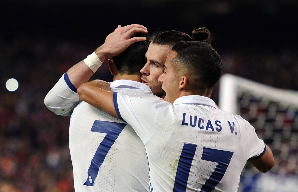 MADRID, SPAIN - NOVEMBER 19: Cristiano Ronaldo of Real Madrid celebrates with Gareth Bale and Lucas Vazquez after scoring Real's 2nd goal during the La Liga match between Club Atletico de Madrid and Real Madrid CF at Vicente Calderon Stadium on November 19, 2016 in Madrid, Spain. (Photo by Denis Doyle/Getty Images)