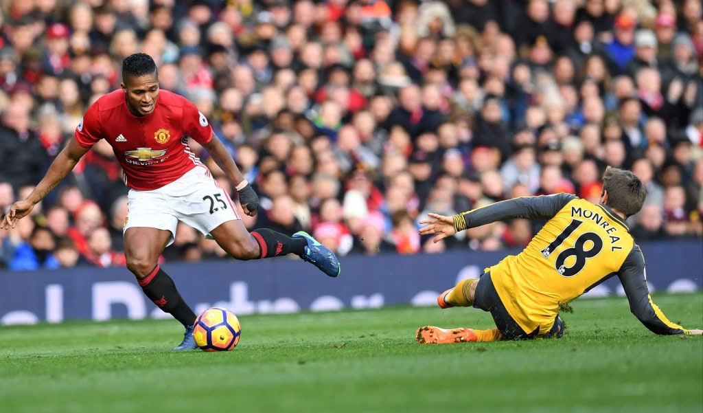 Manchester United's Ecuadorian midfielder Antonio Valencia (L) vies with Arsenal's Spanish defender Nacho Monreal during the English Premier League football match between Manchester United and Arsenal at Old Trafford in Manchester, north west England, on November 19, 2016. / AFP / Paul ELLIS / RESTRICTED TO EDITORIAL USE. No use with unauthorized audio, video, data, fixture lists, club/league logos or 'live' services. Online in-match use limited to 75 images, no video emulation. No use in betting, games or single club/league/player publications. / (Photo credit should read PAUL ELLIS/AFP/Getty Images)