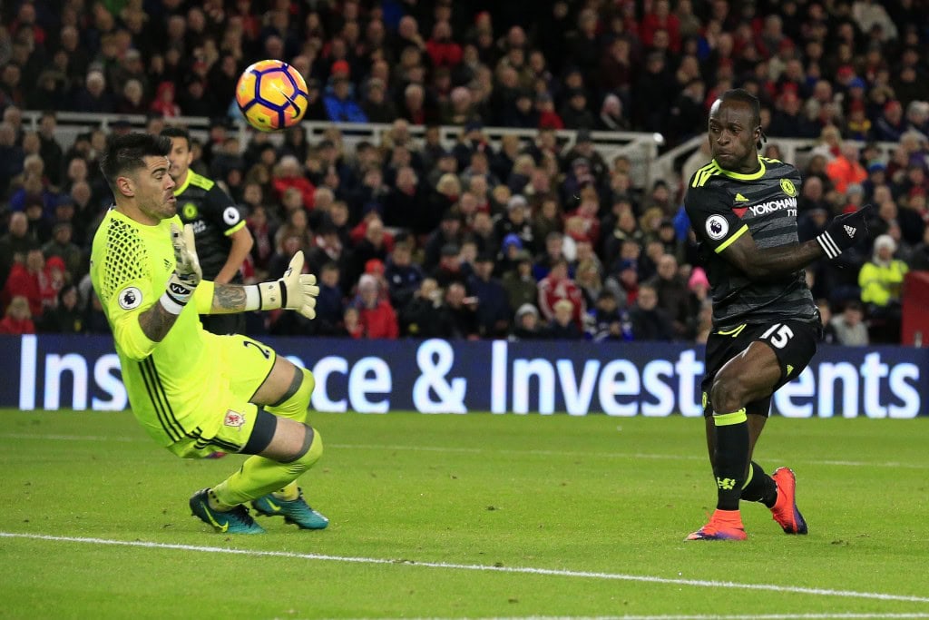 Chelsea's Nigerian midfielder Victor Moses (R) shoots past Middlesbrough's Spanish goalkeeper Victor Valdes but fails to score during the English Premier League football match between Middlesbrough and Cheslea at Riverside Stadium in Middlesbrough, northeast England on November 20, 2016. / AFP / Lindsey PARNABY / RESTRICTED TO EDITORIAL USE. No use with unauthorized audio, video, data, fixture lists, club/league logos or 'live' services. Online in-match use limited to 75 images, no video emulation. No use in betting, games or single club/league/player publications. / (Photo credit should read LINDSEY PARNABY/AFP/Getty Images)