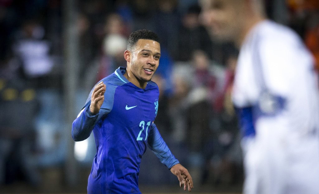 Netherlands' midfielder Memphis Depay celebrates after scoring a goal during the 2018 FIFA World Cup European zone group A qualifying football match between Luxembourg and Netherlands at the Josy Barthel stadium in Luxembourg on November 13, 2016. / AFP / ANP / Jerry Lampen / Netherlands OUT (Photo credit should read JERRY LAMPEN/AFP/Getty Images)